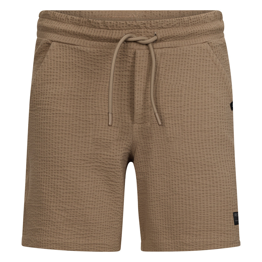 Jongens Sweat shorts Jones van RETOUR in de kleur camel in maat 182-188.