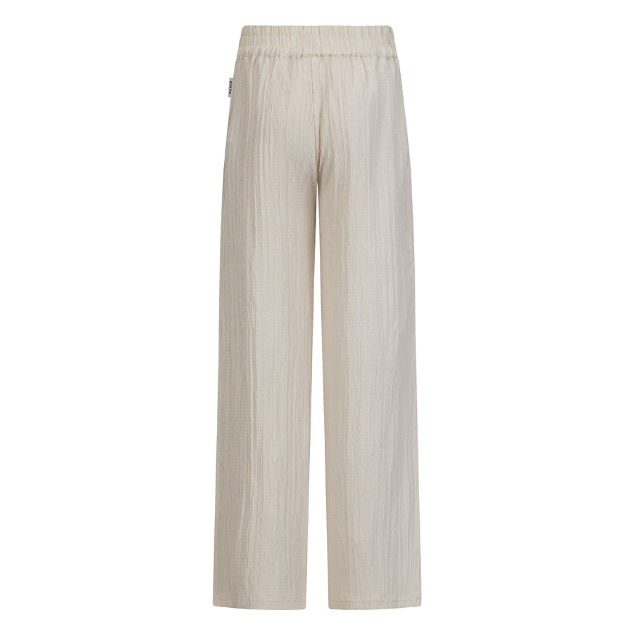Meisjes Crinkle pants Mare van RETOUR in de kleur soft sand in maat 182-188.