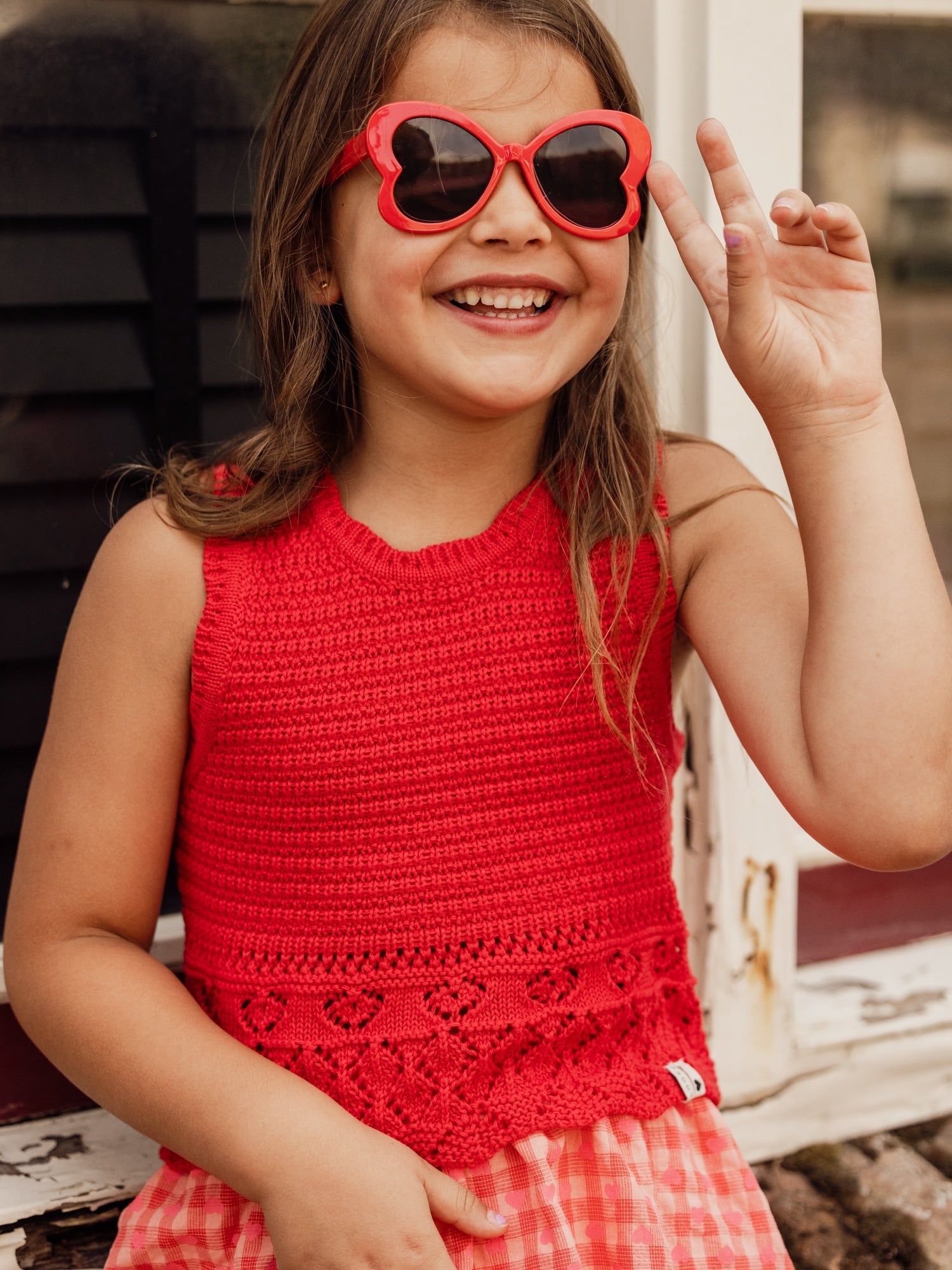 Meisjes knitted spencer van LOOXS Little in de kleur poppy red in maat 128.