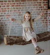 Meisjes Dress Lucia van Gymp in de kleur Beige in maat 92.
