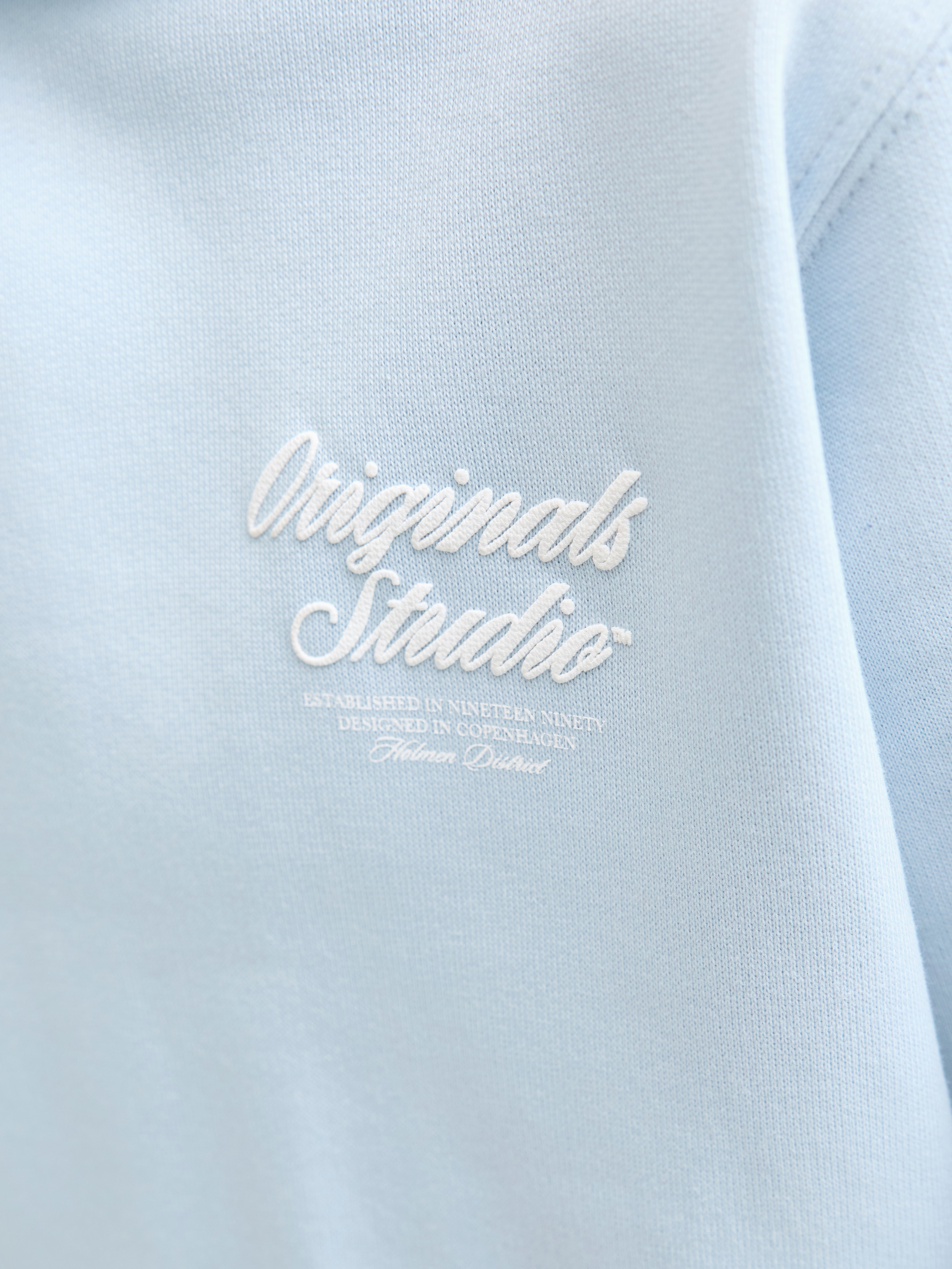 Jongens JORNORREBRO TYPO BACK SWEAT HOOD SN JNR van Jack & Jones Junior in de kleur Skyway in maat 176.