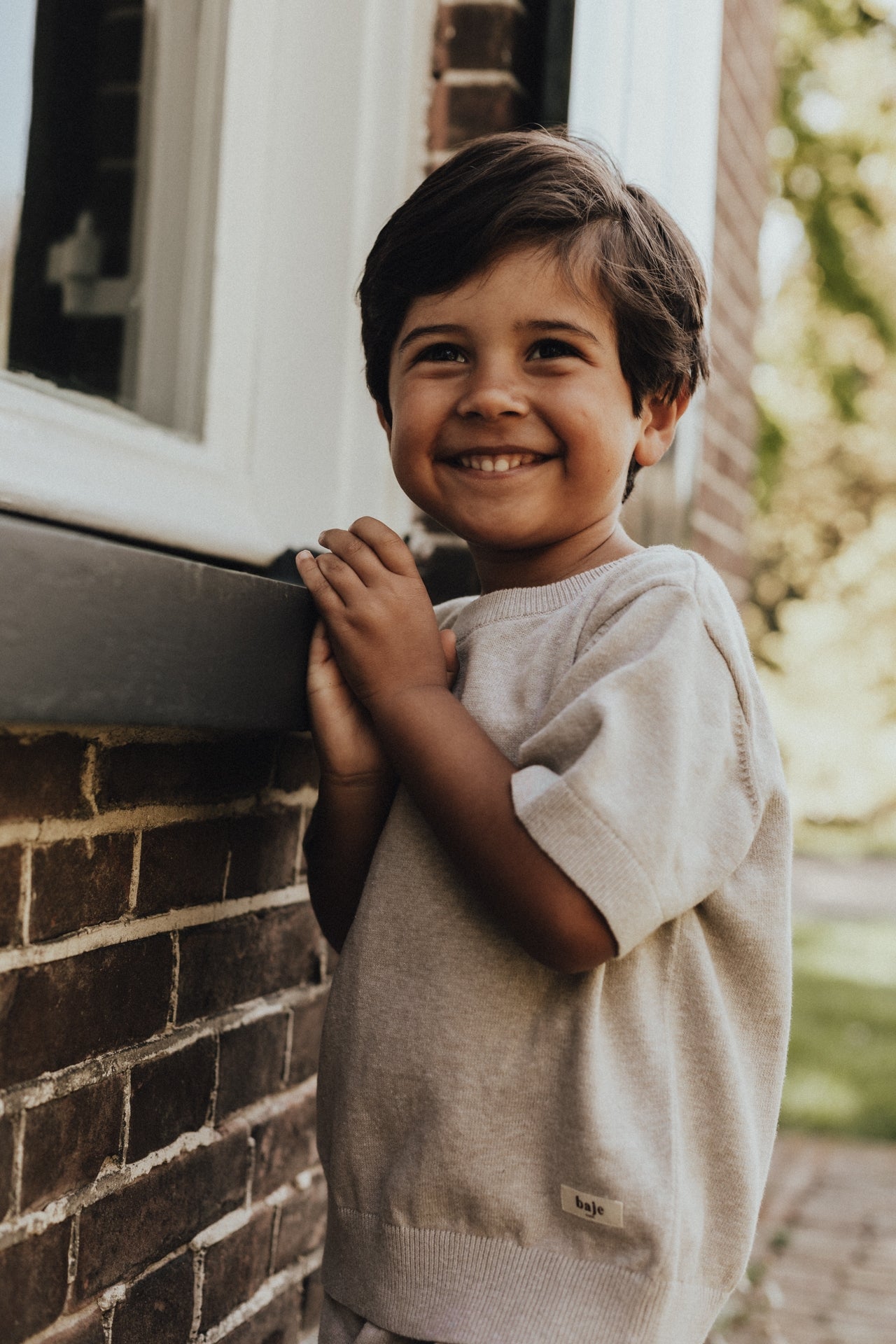 Jongens Knitted SS Cruz van Baje Studio in de kleur Sand melange in maat 134-140.