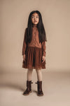 Meisjes Dress Longsleeve Junna van Baje Studio in de kleur Copper brown in maat 134-140.