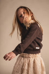 Meisjes Knitted sweater with collar Mai van Baje Studio in de kleur Brown choco in maat 134-140.