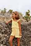 Meisjes Playsuit BETTYQS243 van Quapi in de kleur Soft Yellow in maat 122-128.