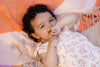 Meisjes Jumpsuit DANIEK van Quapi Newborn in de kleur AOP Peach Dot in maat 68.