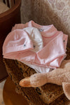 Meisjes Babygrow with feet van Klein Baby in de kleur Baby Pink in maat 62.