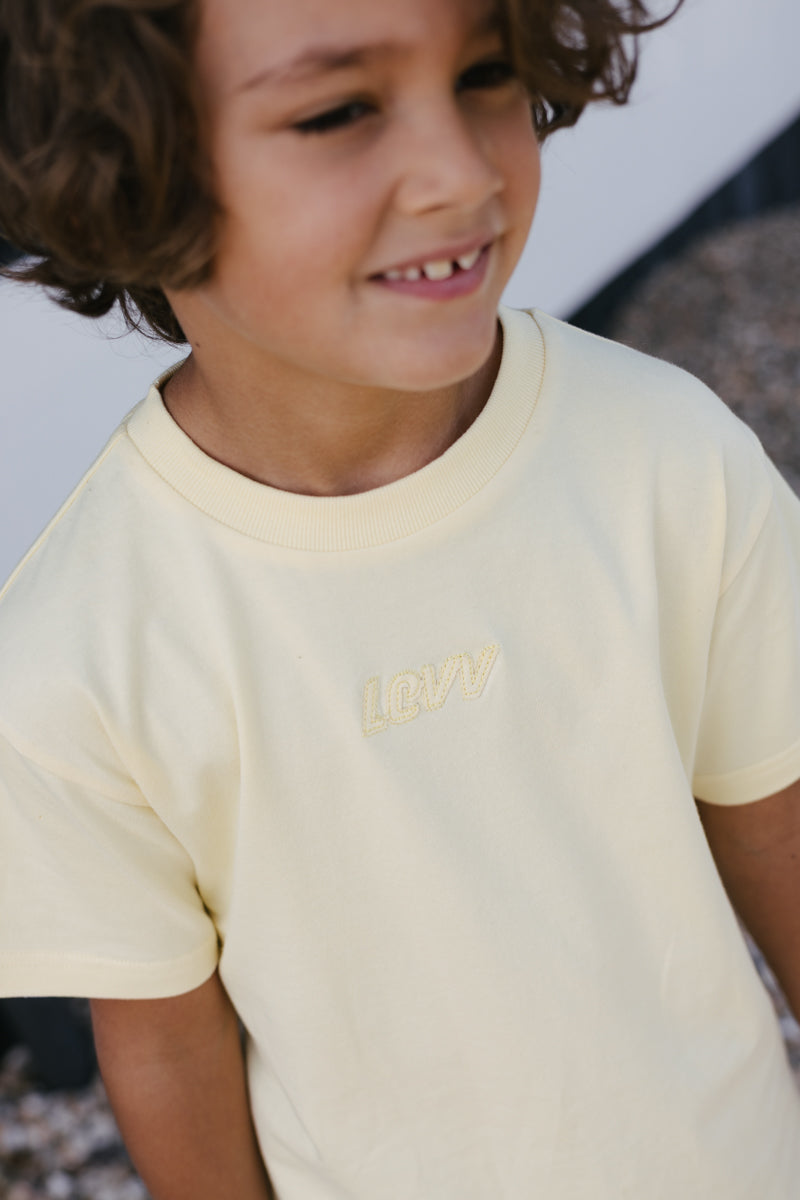Jongens T-Shirt BART van Little Levv in de kleur Pastel Yellow in maat 128.