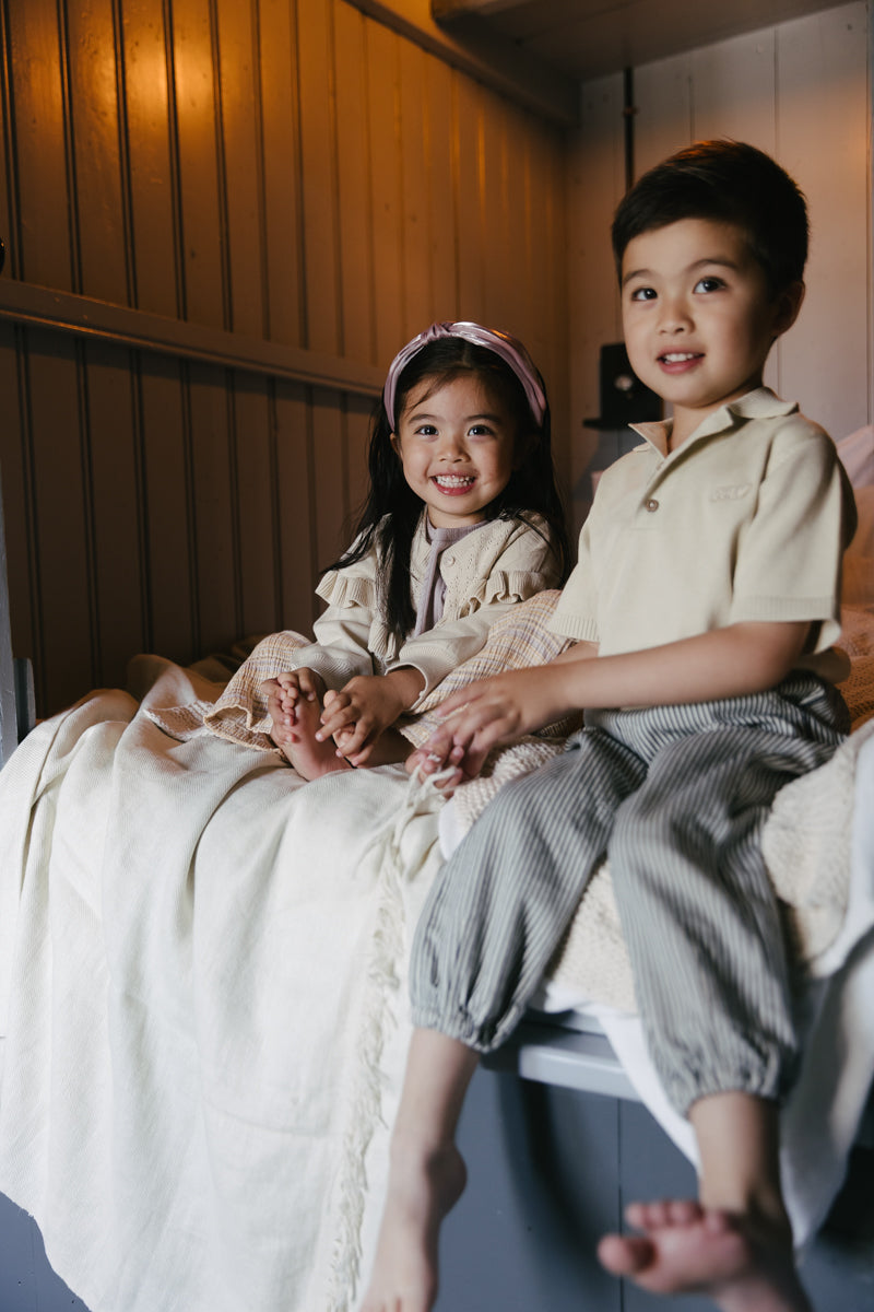 Jongens Polo BENNY van Little Levv in de kleur Beige in maat 128.