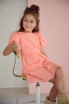 Meisjes Milly AOP dress with bow detail van  in de kleur Orange Coral in maat 134-140.