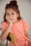 Meisjes Milly AOP dress with bow detail van  in de kleur Orange Coral in maat 134-140.