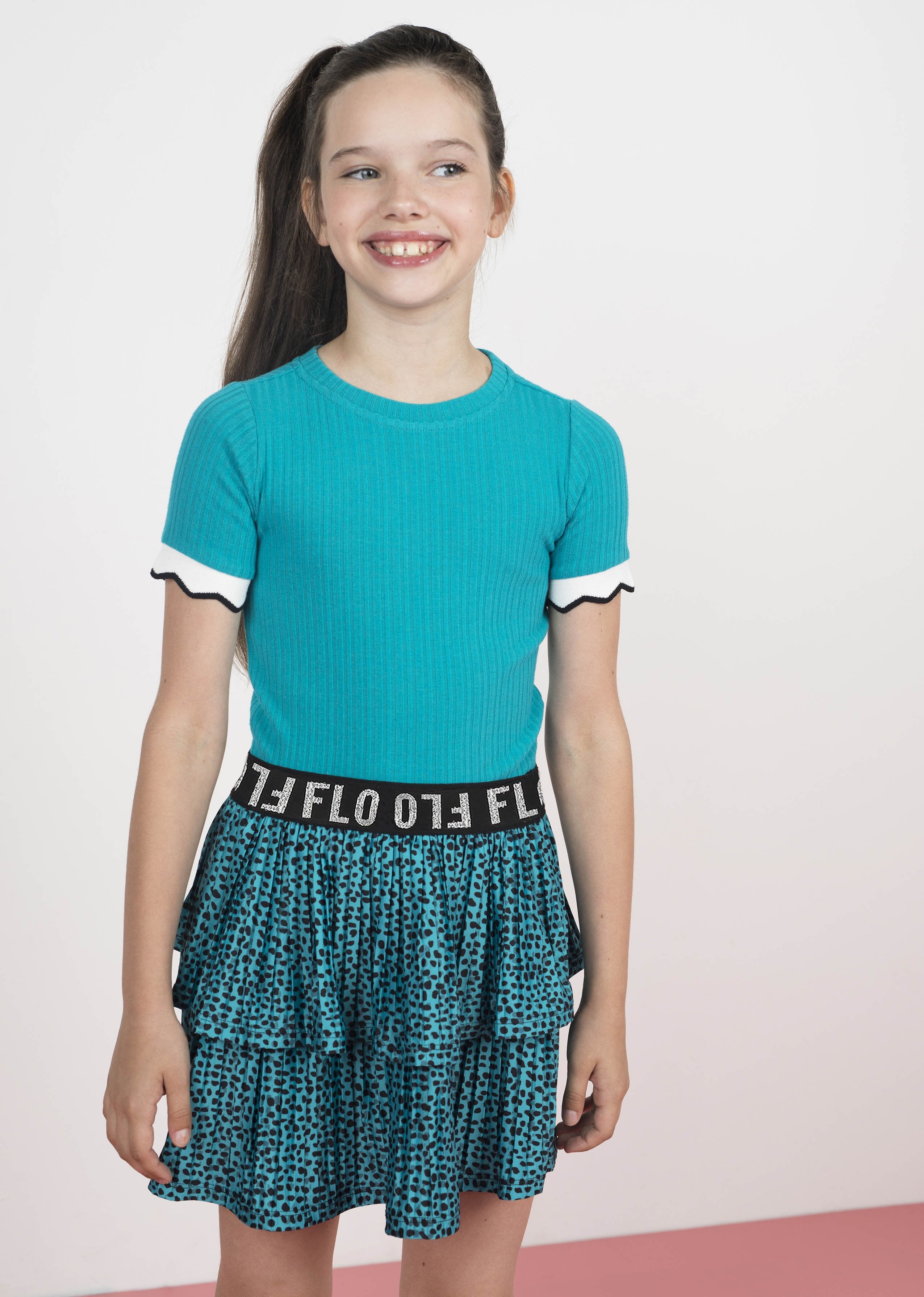 Meisjes Flo girls AO shiny jersey plisse skirt 2 layer van Flo in de kleur Turquoise in maat 140.