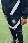 Jongens Junior Sport Pre-Match Trackpants Navy/White van Malelions in de kleur Navy/White in maat 176.