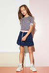 Meisjes Nona short skirt with foil AOP van NoNo in de kleur Navy Blazer in maat 146/152.