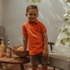 Jongens Polo Elton | Pique van Your Wishes in de kleur Flame in maat 98.